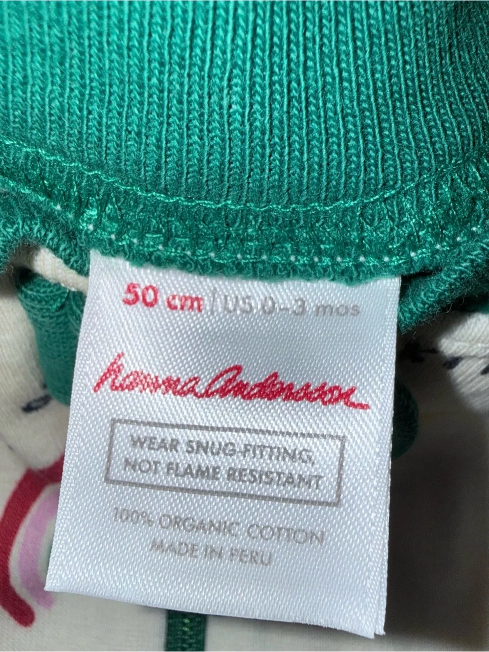 Hanna Andersson Cream Romper with Green Trim and Multicolor Prints